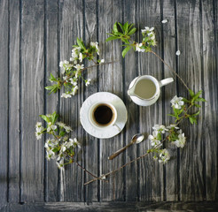 Cup of coffee and beautiful bouquet of flowers in cafe