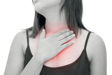 Woman suffering from acid reflux or heartburn, isolated on white background