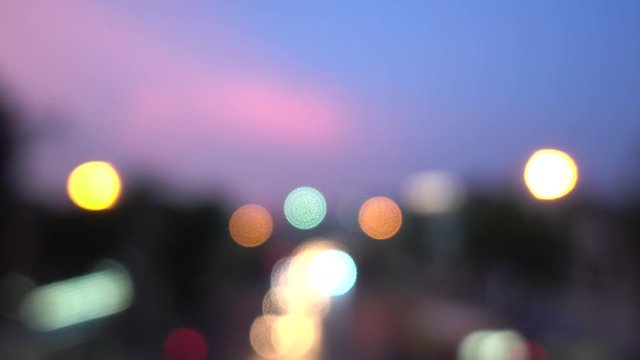 4K Bokeh of car lights. On the street at night Colorful Circles Video Background Loop Glassy circular shapes perform a colorful dance. motion background that is just perfectly suited for DVDs, events