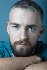Portrait of a young man with a beard. Toned