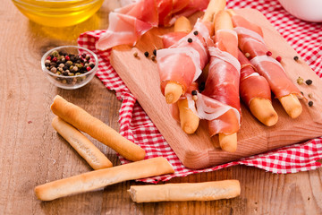 Grissini breadsticks with ham. 