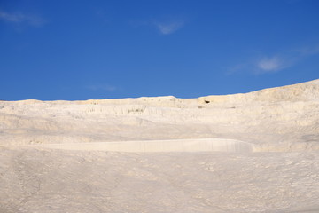 Pamukkale Thermal Pools, Pamukkale in south-west Turkey, cotton castle. The city contains hot springs and travertines, terraces of carbonate minerals left by the flowing water.