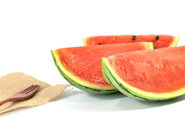 the watermelon isolated on white background with wood fork and sack cloth