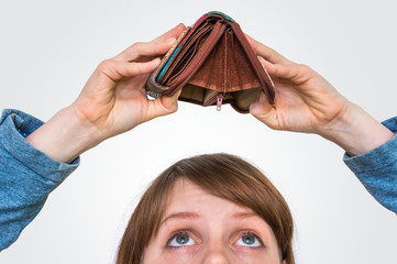Woman holding an empty wallet, she hasn't money