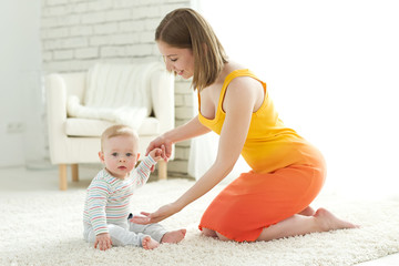 Woman playing with baby 