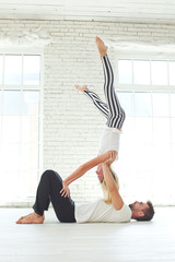 Man and woman doing yoga 