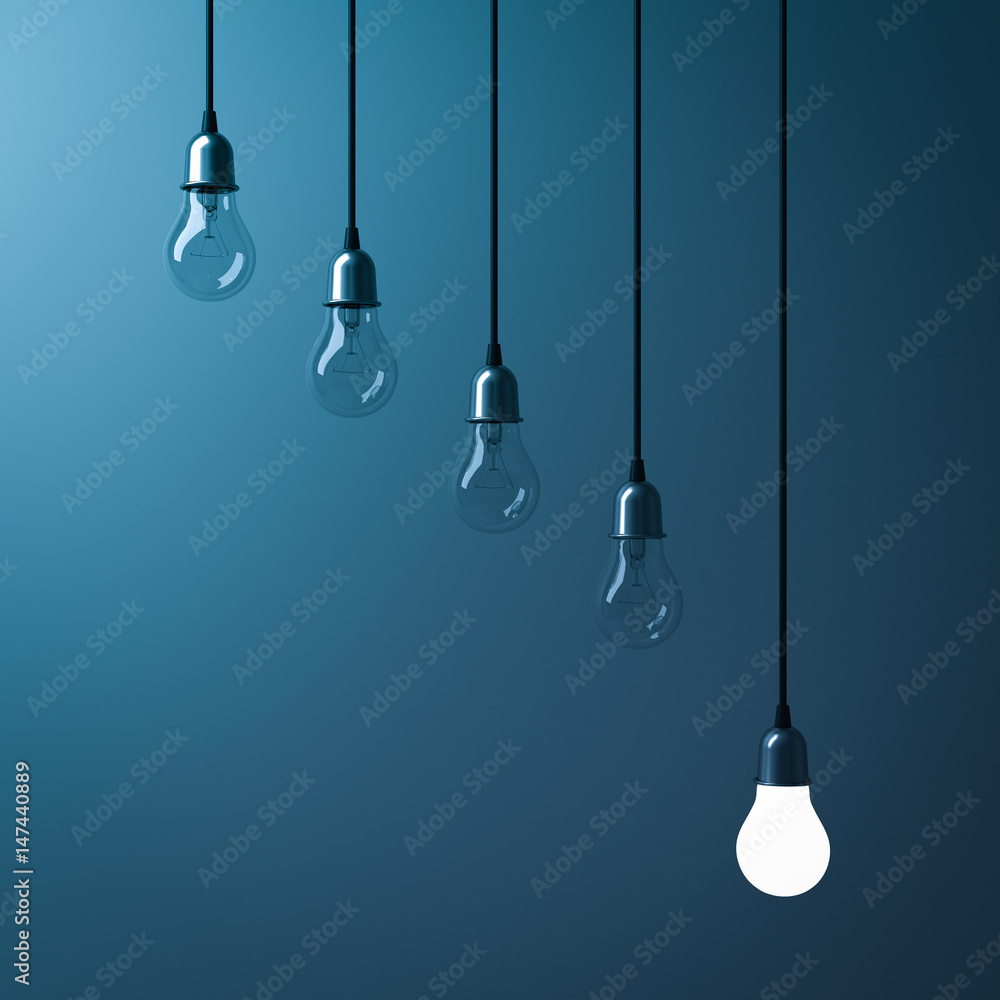 Poster One hanging light bulb glowing different and standing out from unlit incandescent bulbs with reflection on dark cyan background , leadership and different business creative idea concept. 3D rendering.