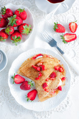 crepes served with cream cheese and fresh strawberry, top view