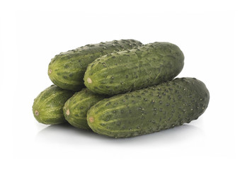 Real green cucumbers on a white background. Isolated