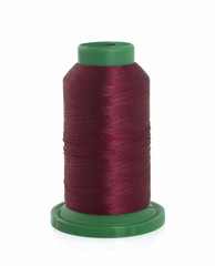 Burgundy spool of thread isolated on white background