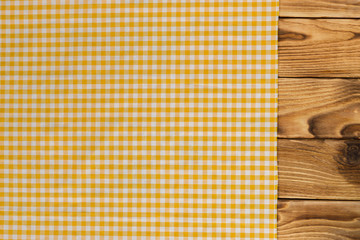 Background with empty wooden table with tablecloth