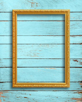 Gold Picture Frame On Vintage Wood Wall.