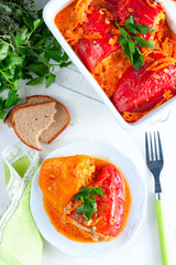Stuffed peppers in tomato sauce, top view
