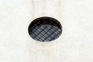 Rounded window on a wall