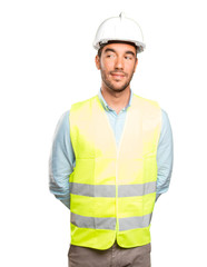 Happy engineer looking against white background