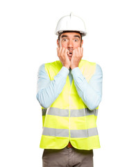 Nervous engineer against white background