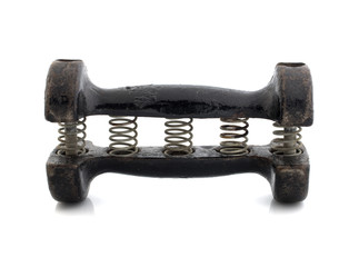 Old black dumbbell with springs on white background