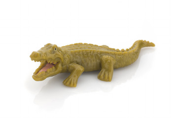 Naklejka premium Green plastic crocodile on a white background. Isolated