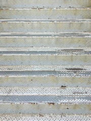 Rusty and old looking metal frame staircase at abandoned industrial site