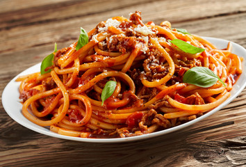 Plate of tasty spicy Italian spaghetti Bolognese