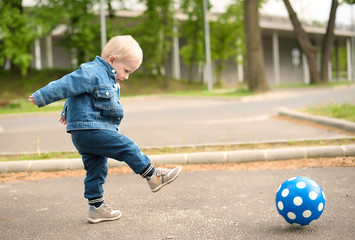 Happy kid playing football