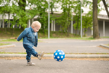 Happy kid playing football