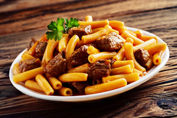 Spicy Italian rigatoni noodles with grilled beef