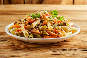 Plate of wholewheat and semolina mixed penne pasta