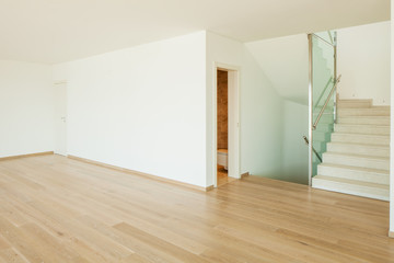 Empty white room with stairs