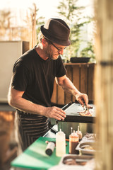 Man cooking in food truck