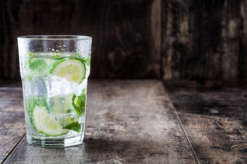 Mojito cocktail in glass on wooden background.Copyspace

