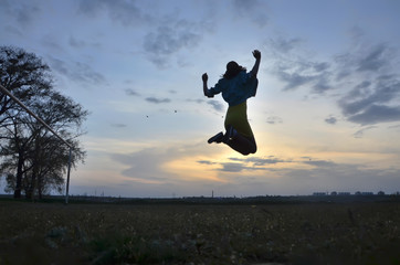 A young woman flying in the sky