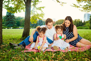 Fototapeta premium Mother, father and two ducks play in developing games nature