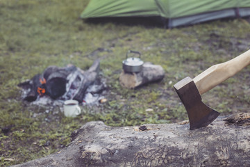 Cooking breakfast on a campfire at a summer camp.