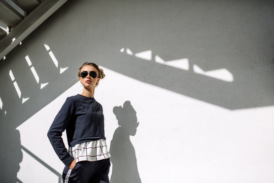 Blonde On City Street. Trendy Urban Look. Black And White Fashion Style