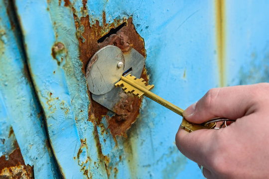 Close-up Of Opening Old Rusty Metal Door