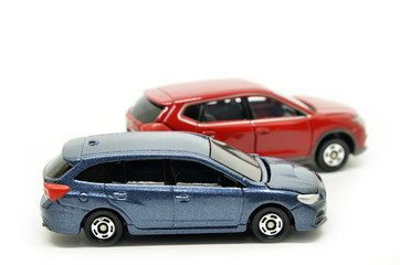 Fototapeta na wymiar Small blue and red toy cars