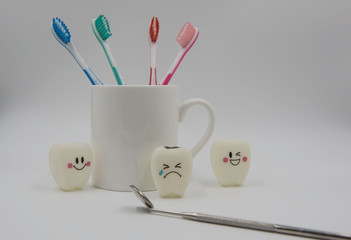 Model Cute toys teeth and glass on a white background.