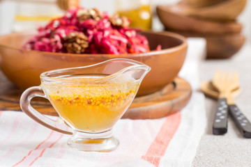 Honey mustard sauce In a glass sauce vessel. Dressing for salad. Selective focus