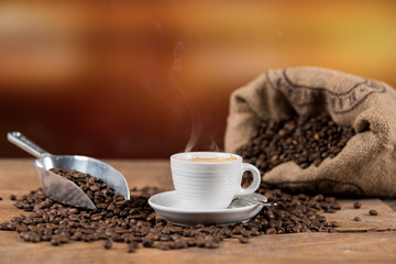 Cup of coffee with coffee beans