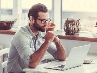 Businessman working in cafe