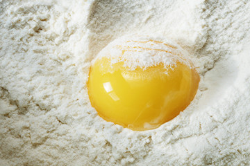 broken egg in the flour