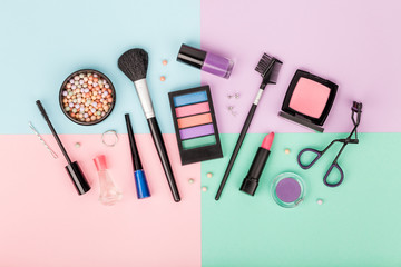 set of professional decorative cosmetics, makeup tools and accessory on colorful background. beauty...