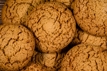 Stack of the oatmeal cookies on wooden table