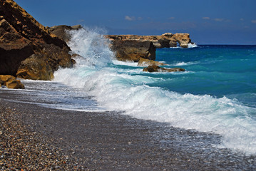 Stormy sea with wave and rock in sunny day, Greece,Crete