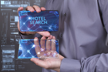 Business, Technology, Internet and network concept. Young businessman working on a virtual screen of the future and sees the inscription: Hotel search