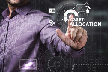 Business, Technology, Internet and network concept. Young businessman working on a virtual screen of the future and sees the inscription: Asset allocation