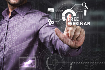 Business, Technology, Internet and network concept. Young businessman working on a virtual screen of the future and sees the inscription: Free webinar