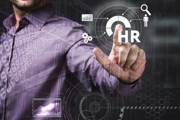 Business, Technology, Internet and network concept. Young businessman working on a virtual screen of the future and sees the inscription: HR