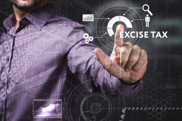 Business, Technology, Internet and network concept. Young businessman working on a virtual screen of the future and sees the inscription: Excise tax